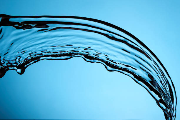istock Splash Of Water Over Blue Background 1987781343