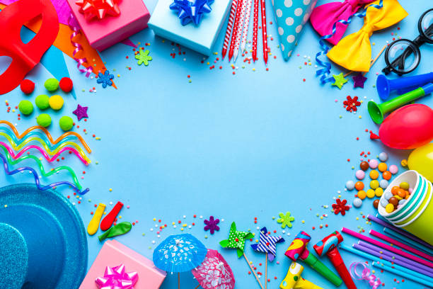 Birthday party or carnival accessories on blue background. Copy space