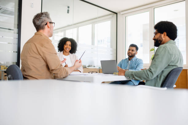 istock A lively team discussion unfolds in a modern office, where diverse colleagues share ideas 1987788736