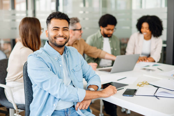 istock Colleagues engage in a lively exchange of ideas in an office 1987788757