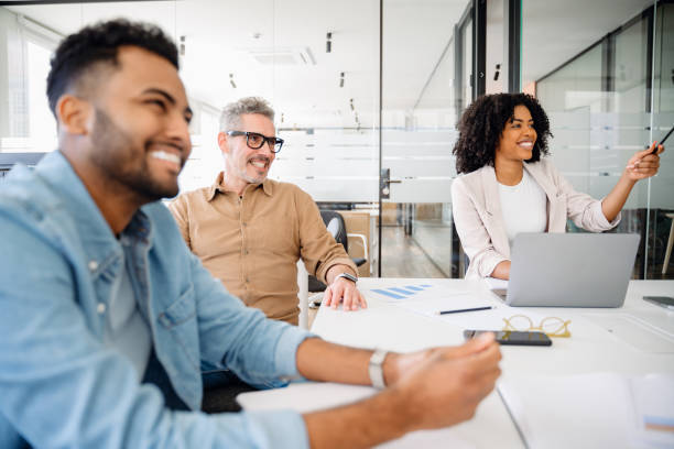 Colleagues engage in a lively exchange of ideas in an office