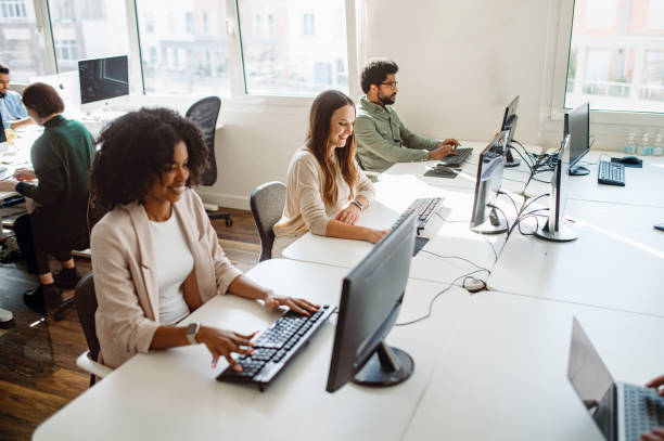 istock A diverse group of young professionals are engaged in their respective tasks on the computers 1987789354