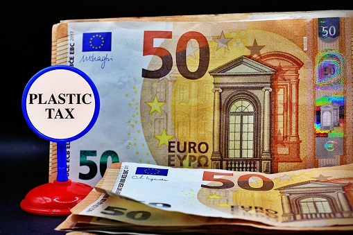 European banknotes with the sign Plastic Tax
