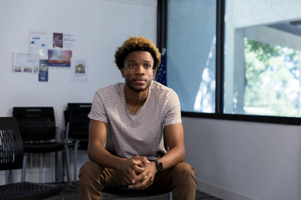 istock Waiting for his appointment, young man thinks about life 1987823932