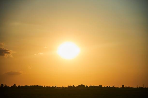 Sunset over the settlement. Natural landscape