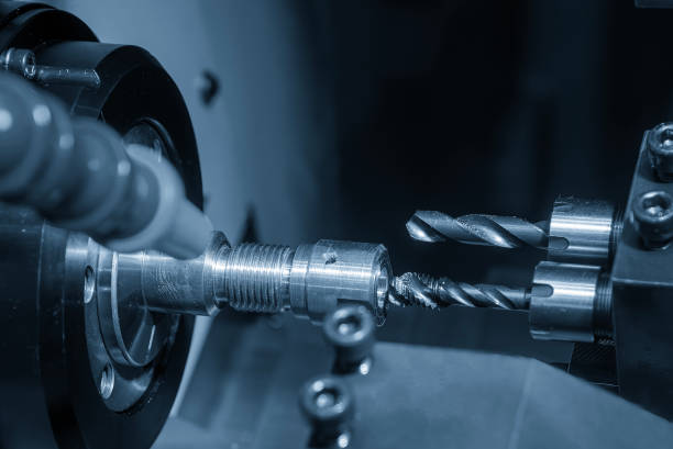 istock The  multi tasking CNC lathe machine swiss type tapping the brass fitting parts. 1987827646