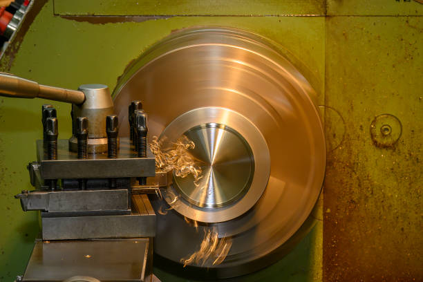 The lathe machine finish cut the brass material parts by lathe tools. The metalworking process by turning machine.
