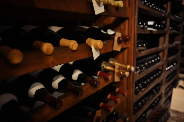 istock wine bottles on cellar shelves 1987859650