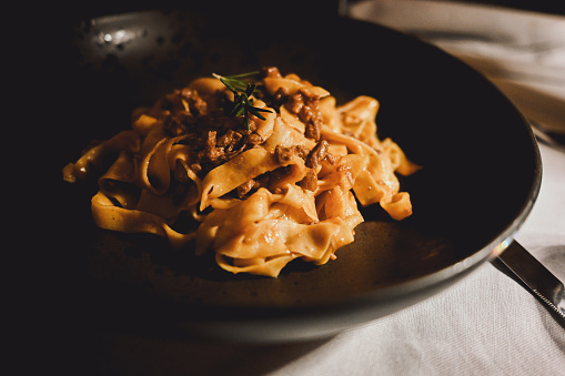 Close up of Italian pasta tagliatelle with ragout.