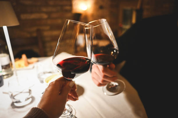 istock Couple toasting wineglasses in a luxury restaurant. 1987861762