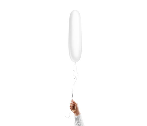 istock Hand holding blank white cylindrical balloon mockup, isolated 1987870725