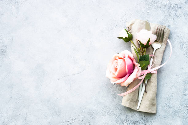 istock Spring Table setting with modern cutlery and rose flowers. 1987873768