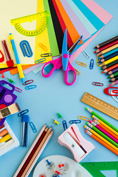 istock School supplies designed on the pastel blue color surface 1987893549