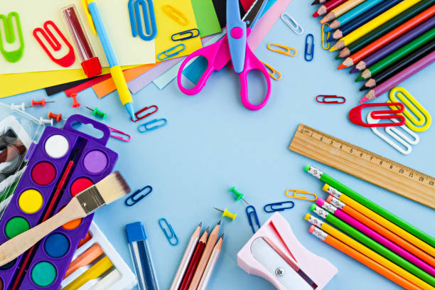istock School supplies designed on the pastel blue color surface 1987894068