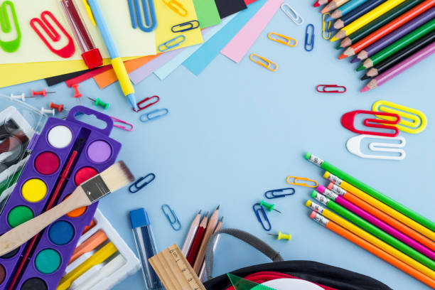 istock School supplies designed on the pastel blue color surface 1987894614