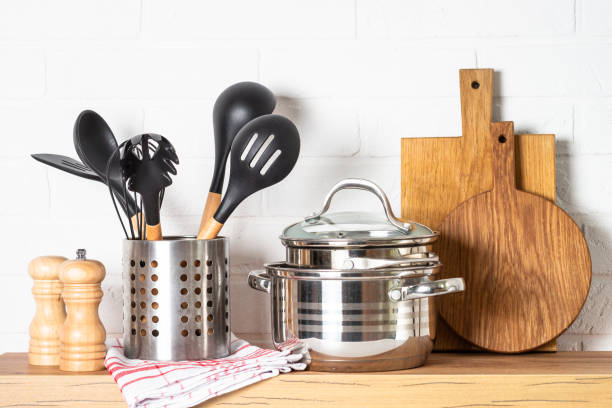 istock . Cooking tools with cooking pots, wooden cutting boards 1987896749