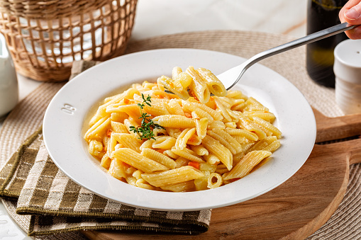 Eating creamy Pasta e Patate con la Provola is a Neapolitan classic meal with potato, cheese and vegetables.