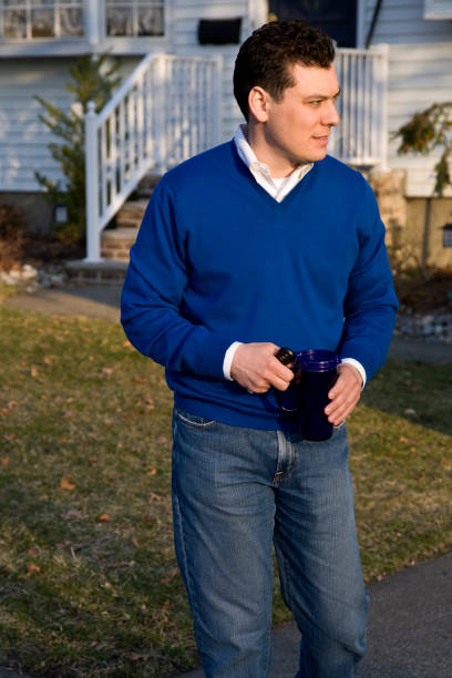 istock 30 something man walking in early morning light 1987975871