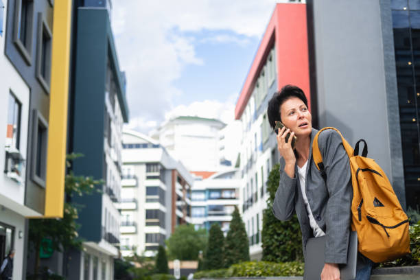 istock Businesswoman on Call in Urban Setting 1987977433