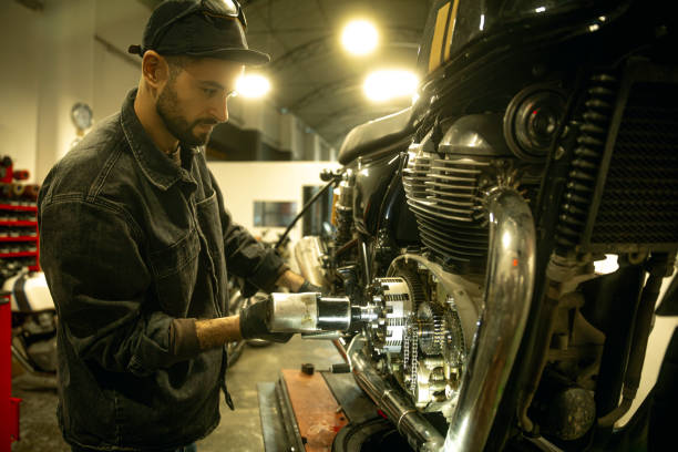 istock Mechanic working on a motorbike 1987981875