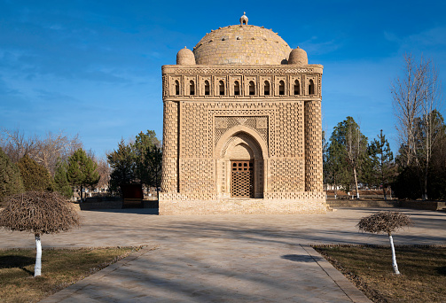 The oldest monument of Central Asian monumental architecture is the Samanid dynastic mausoleum in the historical center of the city on a sunny day, Bukhara, Uzbekistan