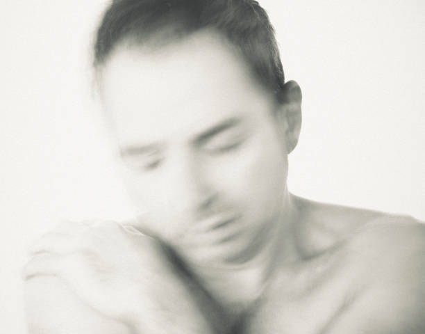 istock A mature man is hugging himself with despair. 1987990076