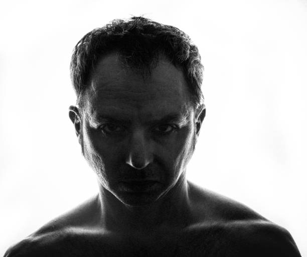 istock Portrait of serious man looking at camera with anger. 1987990079