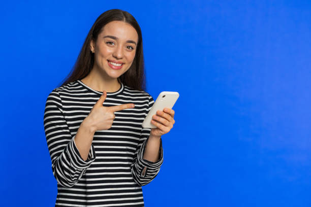 istock Woman use smartphone typing new post on web message browsing addiction of social networks play game 1987991684