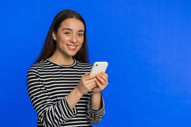 istock Woman use smartphone typing new post on web message browsing addiction of social networks play game 1987991686