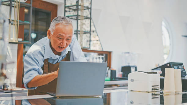 istock Senior Business Owner making video calls 1988008379