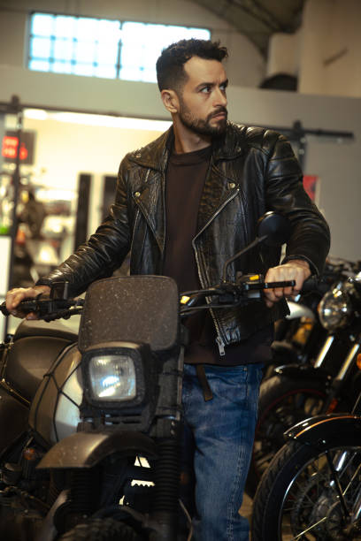 istock Portrait of man and motorcycle 1988018887