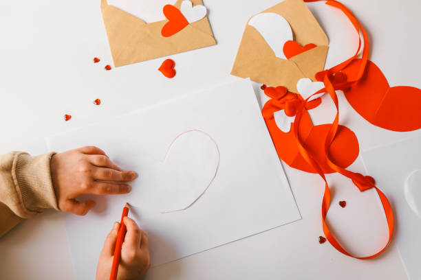 istock Child doing creativity for mother, holiday concept 1988032442
