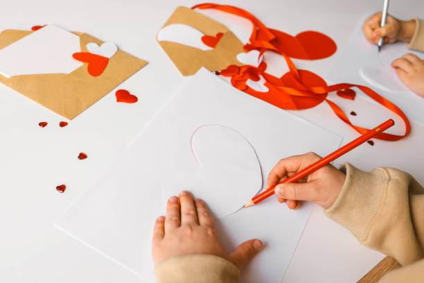 istock Child doing creativity for mother, holiday concept 1988032443