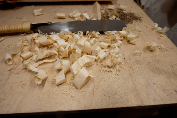 istock Hand saw with wooden chips. 1988034043