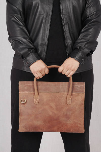istock Female model in black jacket leather 1988057739