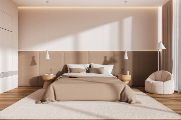 istock White and beige bedroom interior with armchair 1988060312