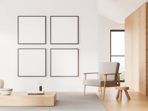 istock White home relax room interior with armchair and coffee table, mockup frames 1988067580