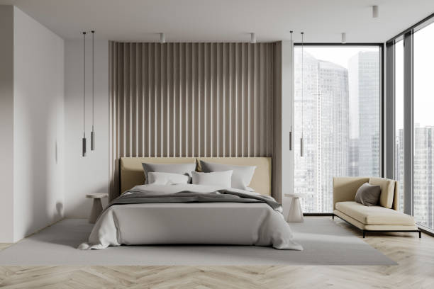 istock White bedroom interior with armchair 1988071784