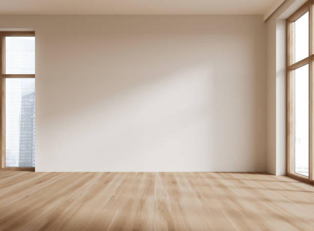 istock Beige home empty living room interior and panoramic window on skyscrapers 1988072304