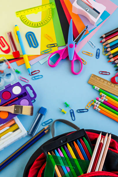 istock School supplies designed on the pastel blue color surface 1988073382