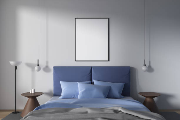 istock Cozy hotel bedroom interior with bed and minimalist decoration. Mockup frame 1988074449