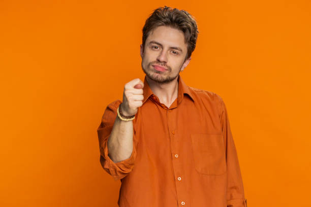 istock Greedy avaricious man showing fig negative gesture rapacious avaricious acquisitive refusal fig sign 1988077844