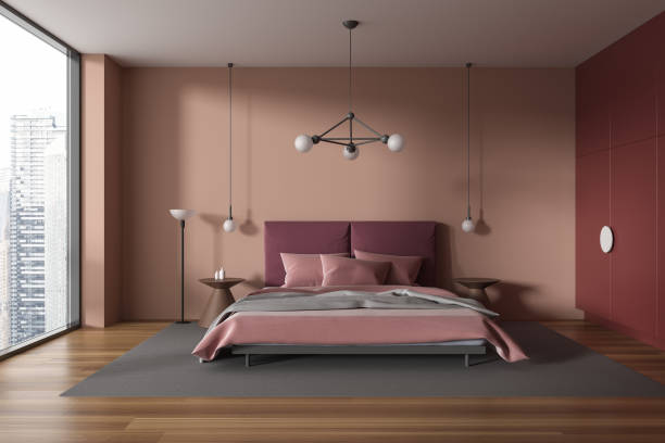istock Bright hotel bedroom interior with bed and decoration, panoramic window 1988078927
