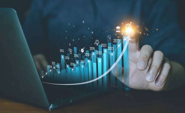 istock Concept business Growing graph, chart with company Progress and growth, Economic Growth, Business people check and Analytic data of Annual Economic Growth Data. Digital screen touch. 1988099070