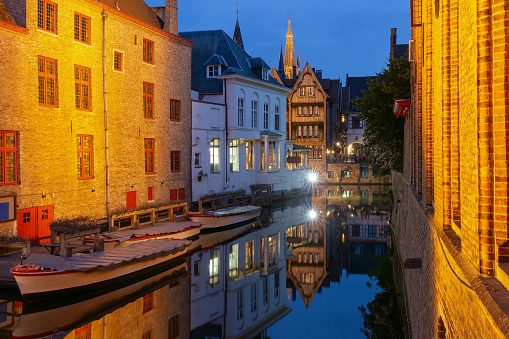 Scenic cityscape with the picturesque night medieval canal Dijver in Bruges, Belgium