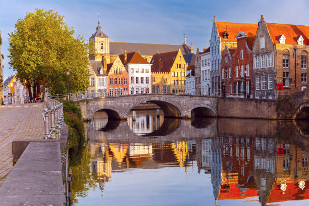 istock Bruges canal and bridge at sunset, Belgium 1988139189