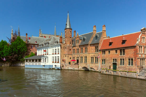 Scenic sunny medieval fairytale town from the quay Rosary in Bruges, Belgium