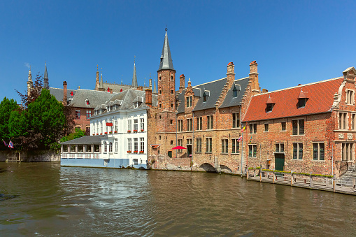 Scenic sunny medieval fairytale town from the quay Rosary in Bruges, Belgium