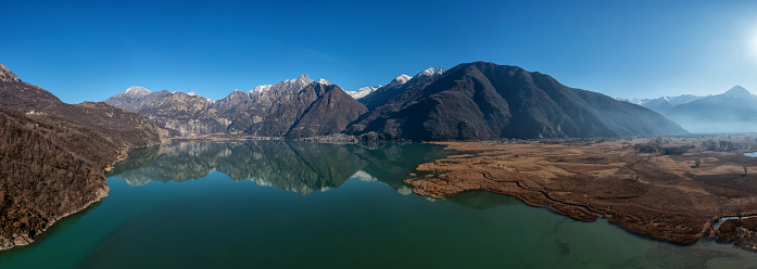 Natural reserve of Pian di Spagna flooded with Mount Legnone reflected in the water Valtellina, Lombardy ,Italy Europe.