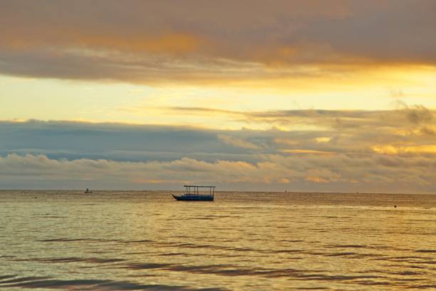 istock Golden sun light reflections all over sea and sky 1988141865